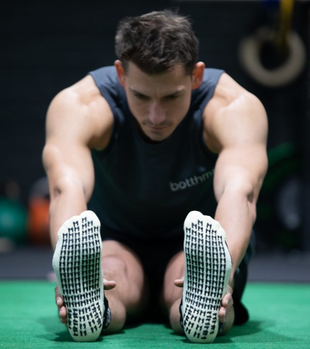 man doing exercise wearing botthms sport t-shirt